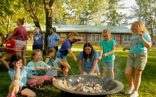 a group of people around a fire