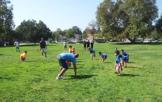 a group of people playing in a field