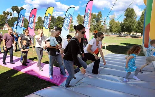 a group of people playing on a playground