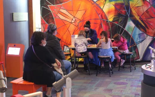 a group of people sitting at a table