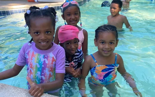 a group of children in a pool