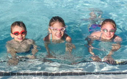a group of kids in a pool