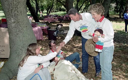 a group of people holding a baby