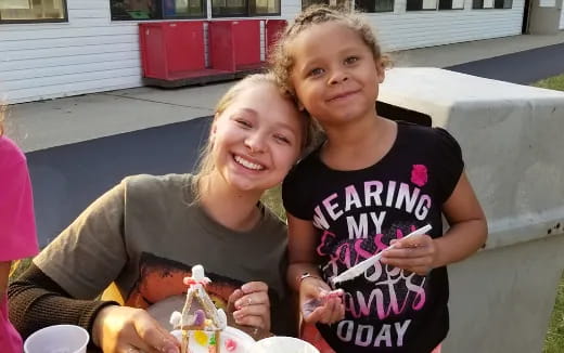a person and a girl smiling