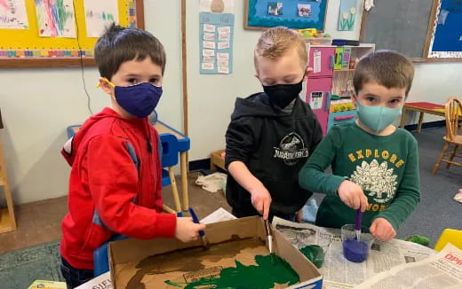 a group of children wearing masks