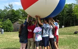 a group of people holding a flag