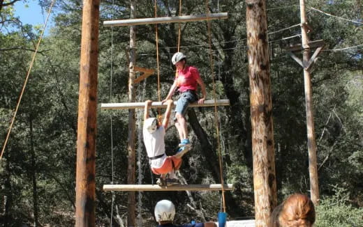 a group of people on a wooden structure