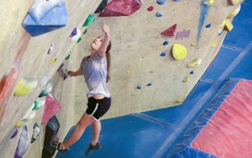 a person climbing a rock wall
