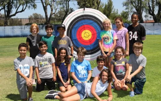 a group of kids posing for a photo