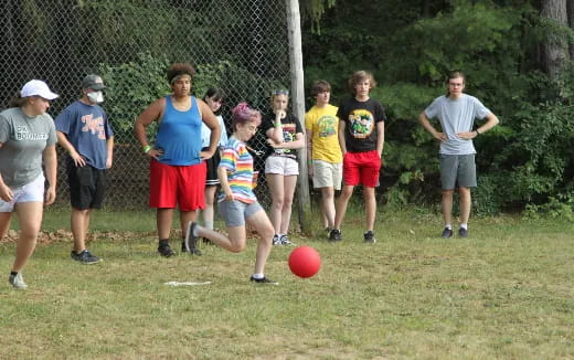 a group of people playing with a ball