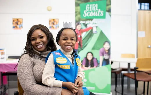 a woman and a girl smiling