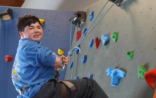 a person climbing a rock wall