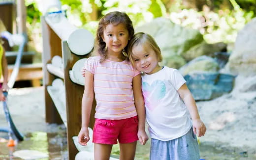 a couple of girls posing for the camera