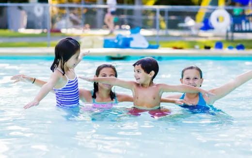 a group of people in a pool