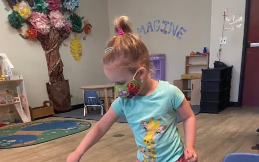 a girl with a flower on her face