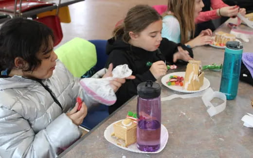a group of people eating cake