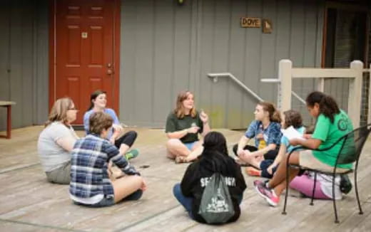 a group of people sitting in chairs