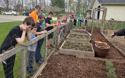 a group of people working in a garden