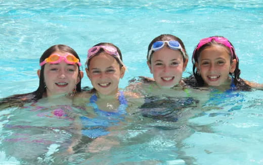 a group of women in a pool