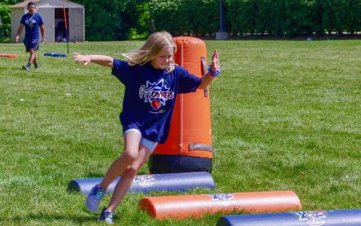 a girl playing on a playground
