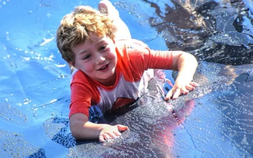 a boy in a pool
