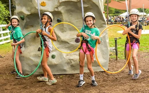 a group of kids holding hula hoops