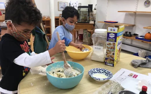 a woman and a boy preparing food