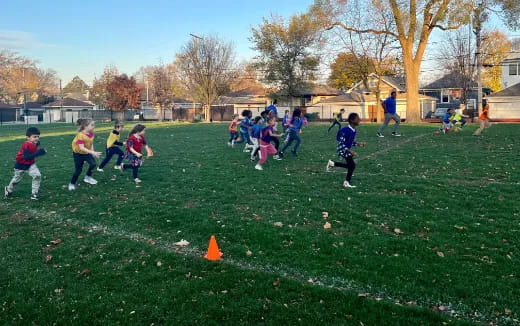 a group of kids playing in a park