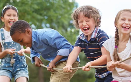 a group of children playing with a toy