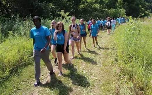 a group of people running on a trail