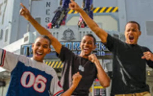 a group of men holding up their arms