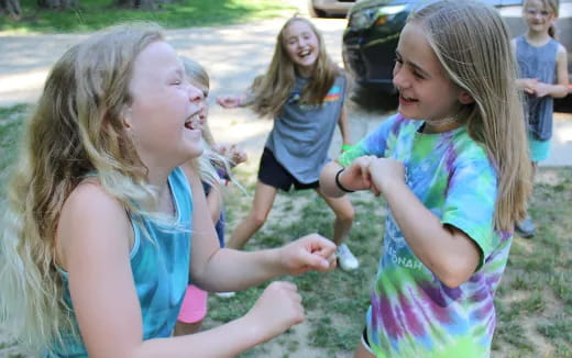 a group of girls playing outside
