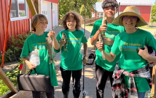 a group of kids holding sticks