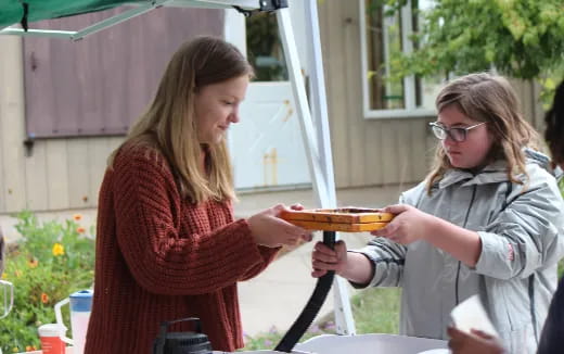 a woman holding a plate of food