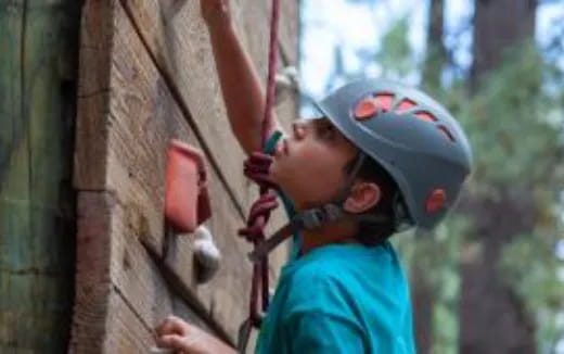 a person wearing a helmet and harness