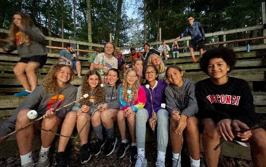 a group of people sitting on a bench