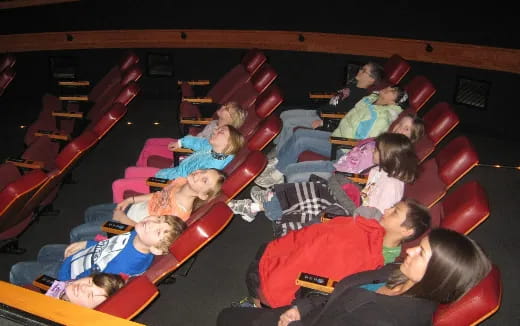 a group of children in a theater