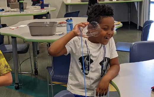a young boy wearing a stethoscope around his neck