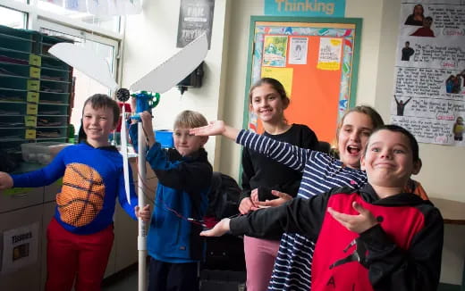 a group of kids posing for a photo