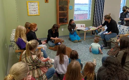 a group of people sitting in a circle
