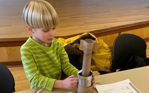 a boy sitting at a table