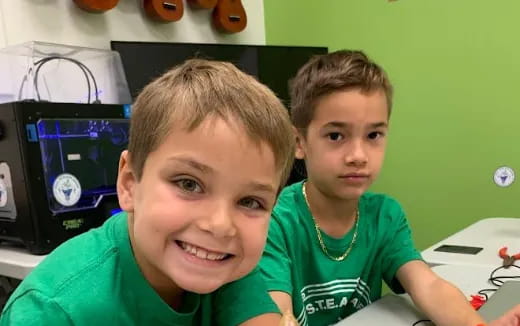 a couple of boys posing for the camera