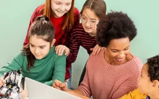 a group of people looking at a paper