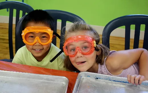 a group of children in a pool