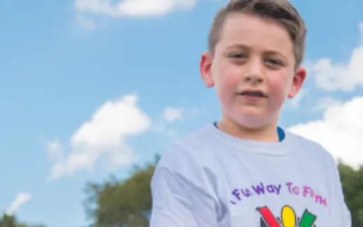 a boy smiling for the camera