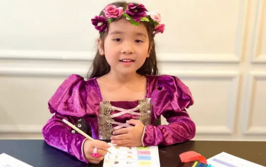 a girl wearing a purple dress