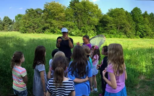a group of people standing in a field