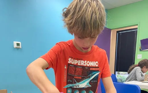 a boy with a red shirt