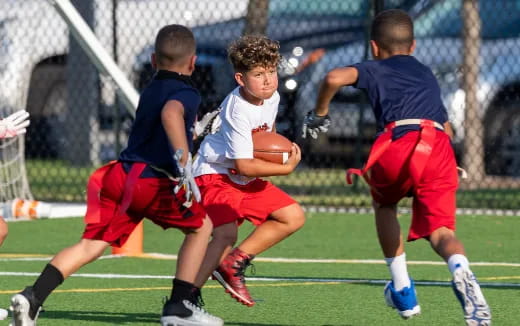 a group of boys playing football