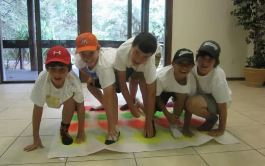 a group of kids playing on a mat